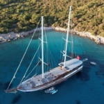 Book a 36m luxury gulet with 6 cabins and crew. Enjoy private cruises from Bodrum to Fethiye, including water activities and gourmet dining.