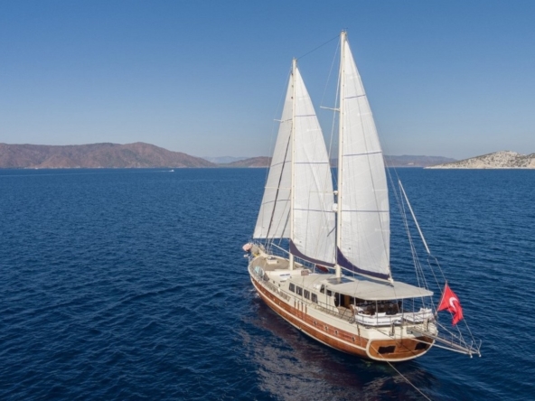 Charter the 34m Kaptan Mehmet Buğra Gulet in Turkey. 8 cabins for 18 guests, Jacuzzi on deck, professional crew, and premium Blue Cruise along Marmaris, Bodrum, Göcek & Aegean coasts.