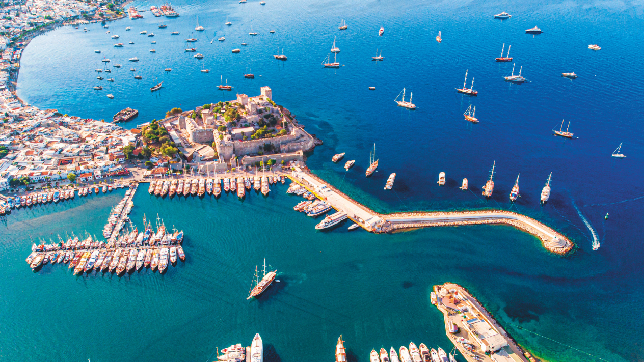 Compare Gocek and Bodrum for a private Blue Cruise in Turkey, including bays, sailing times, families, nightlife, routes, costs and airport access.